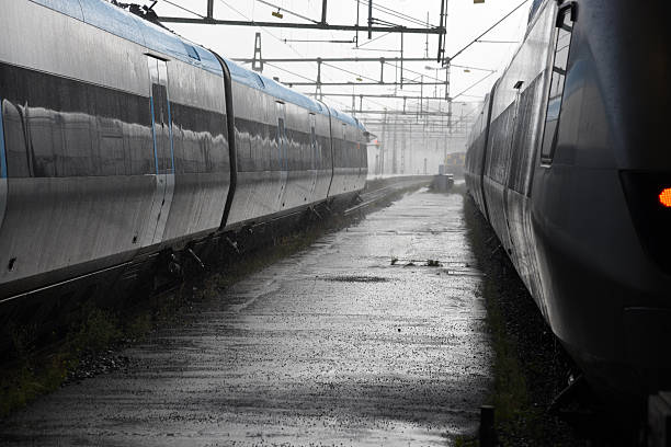 Gothenburg, Sweden, August 05.2025.Two Swedish passenger trains in Gothenburg at Centralstatation. Captured during a rainy day in summer season.