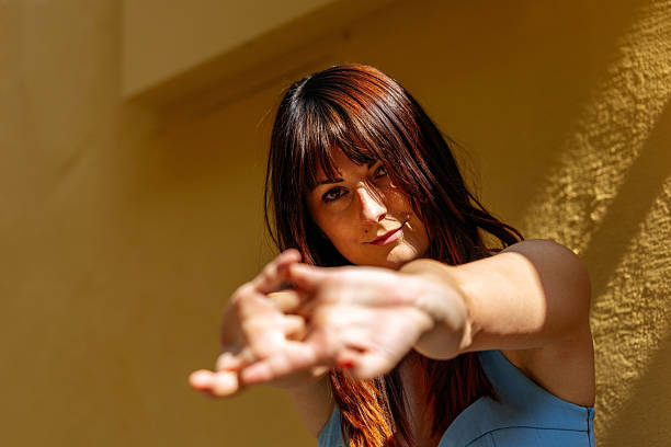 Female caucasian young adult with long brown hair outdoors