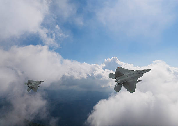 istock F-22 jet aircraft flying over clouds. 2254630778