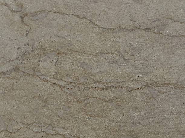 istock Natural stone texture featuring brown and beige tones useful as a background or for design projects 2254631633