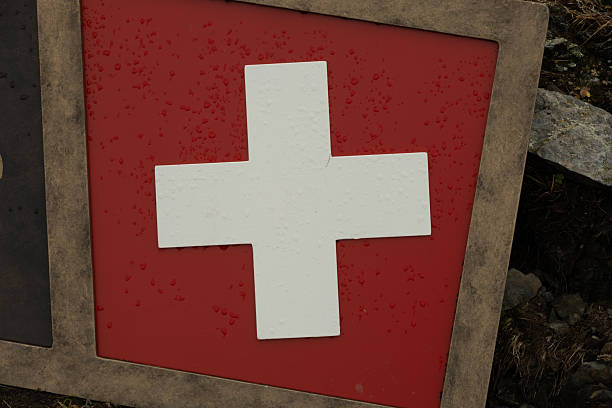 Swiss Flag Emblem On Sign on City Street