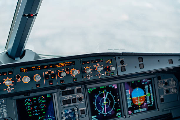 istock Autopilot control panel and cockpit displays inside commercial aircraft 2254642021