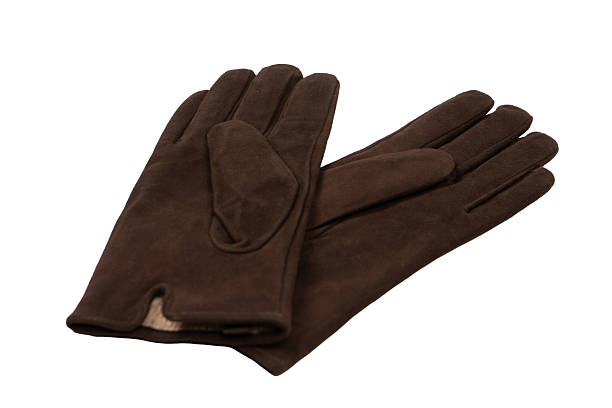 Brown suede gloves isolated on a white background.