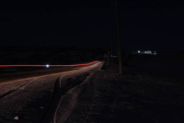 istock A car driving on a road at night 2254644062