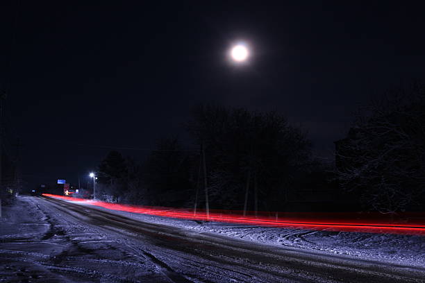 istock A road with snow at night 2254644076