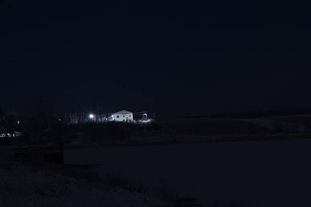istock A dark sky with stars and a building in the background 2254644148