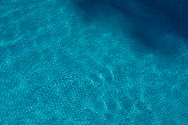 istock Swimming pool bottom with blue tiled texture, summer mood background 2254644539