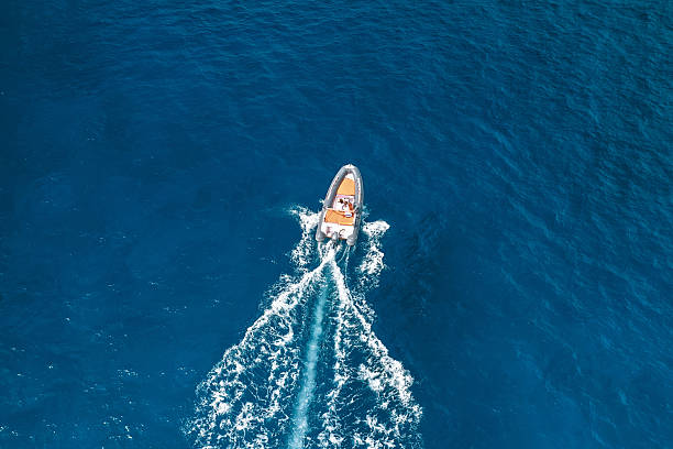 istock Speedboat leaving white wake on deep ocean 2254645555