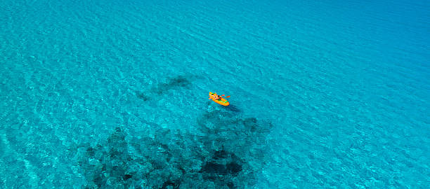 istock Kayak over clear water above coral reef 2254645566