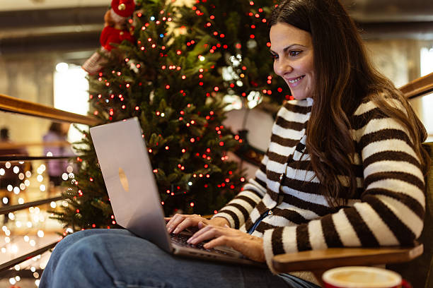 istock Festive Online Shopping by Christmas Tree 2254645683
