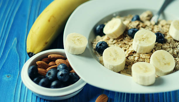 Healthy eating, food and diet concept - oatmeal with berries, n