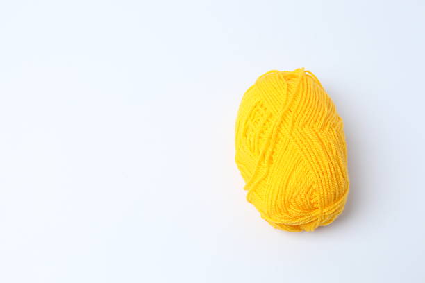 Various yarn, knitting needles on a white background, close-up