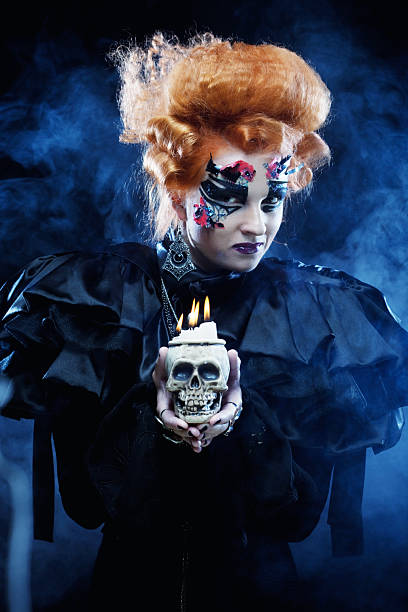 Picture a beautiful fantasy woman with skull. Halloween theme. Party theme.