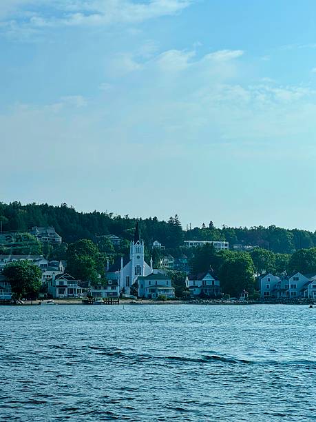 istock Lakeside Town View with White Steeple Church 2254652899