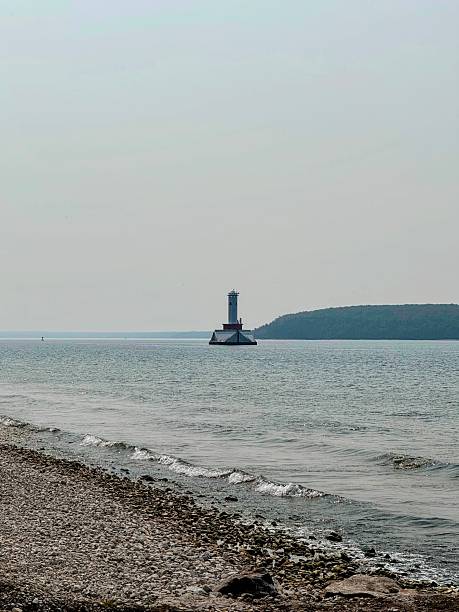 istock Round Island Passage Light Seen from Stony Shore 2254653056