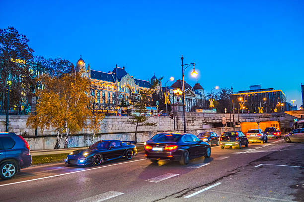 Budapest,Hungary-December 17th 2014:Night view of beautiful buildings and street traffic at Christmastime at Danube riverside street against twilight skies