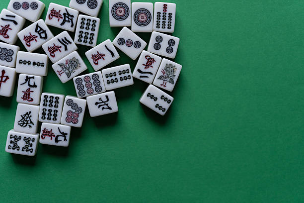 istock Mahjong tiles lined up on a green background 2254654390