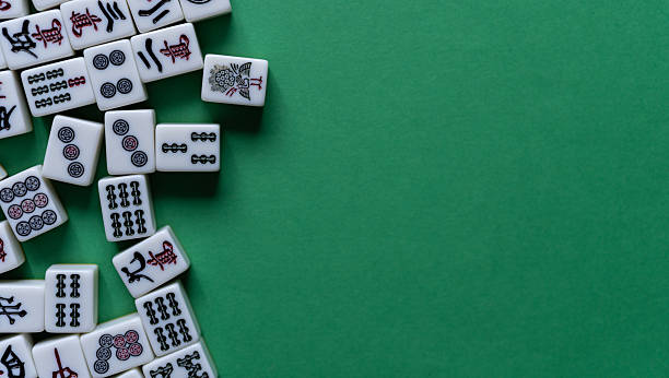 istock Mahjong tiles lined up on a green background 2254654410