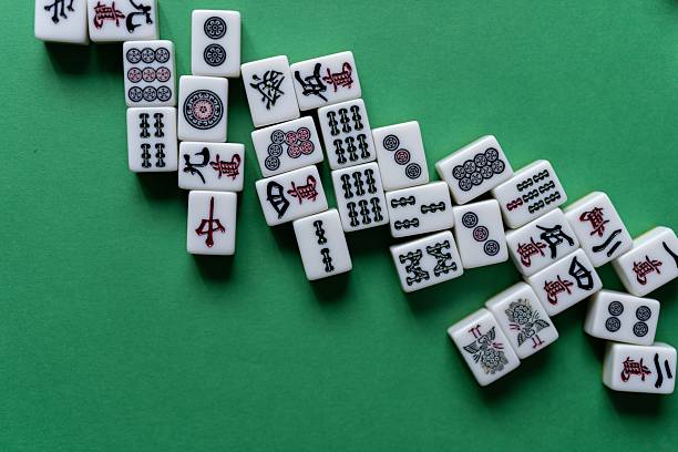 istock Mahjong tiles lined up on a green background 2254654424