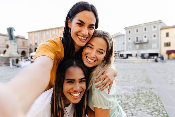 istock Three multiracial young women taking selfie portrait during summer vacation 2254655243