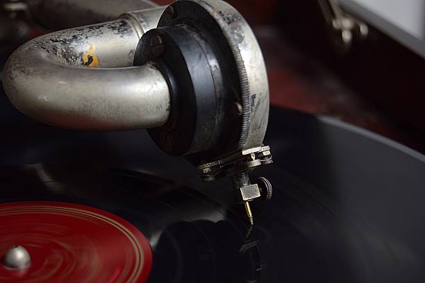 Hand crank 78 rpm record player with a shellac record. Close -up of stylus.