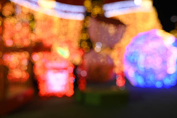 McAdenville, North Carolina, USA - December 1, 2014: The quiet little town of McAdenville, which lies along the South Fork River in Gaston County N.C., comes alive in spectacular fashion each year as Christmas draws near. Almost overnight, the small textile town is transformed into “Christmas Town, USA.” A tradition since 1956, Victorian-style, brick and wood sided homes are beautifully and tastefully decorated for the Holiday Season. Taken just before sunset to include a beautiful and colorful sky as a backdrop to this festive image.