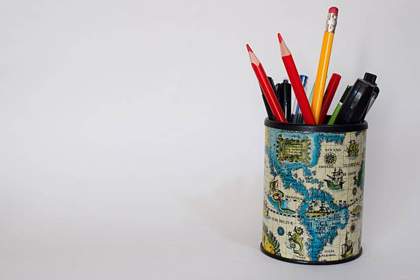Pencil holder with world map (America) design isolated on a white background, representing education, travel, geography, and creative workspace organization.