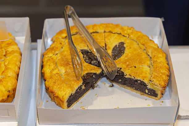 Round Baked Pastry Dessert Black Poppy Seeds Pie Tart in Box With Tongs