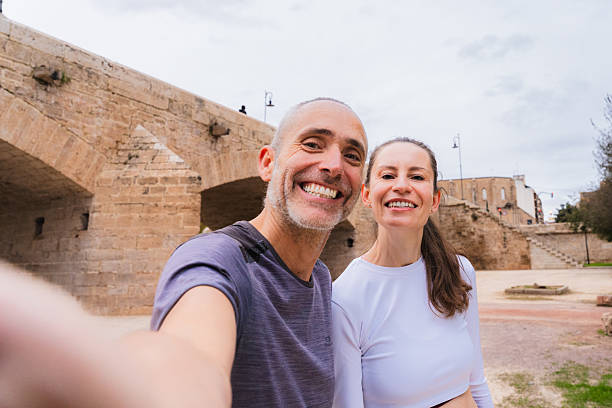 istock Mid adult friends smiling taking selfie after exercising 2254667331