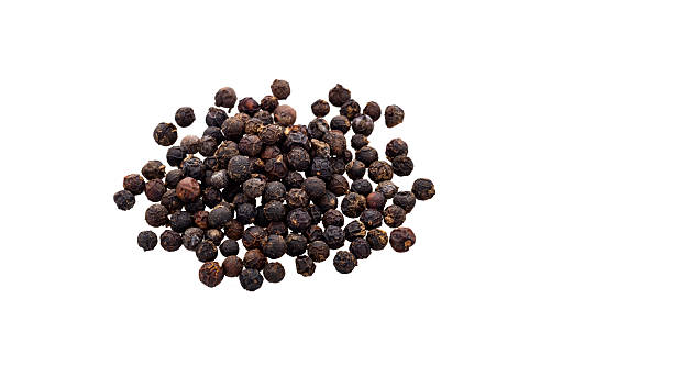 istock Black peppercorns on white background - Piper nigrum 2254667756