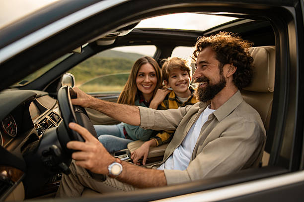 istock Family enjoying car trip during summer vacation 2254669279