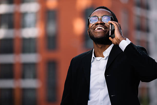 istock Young stylish man talk on phone and smile 2254670996