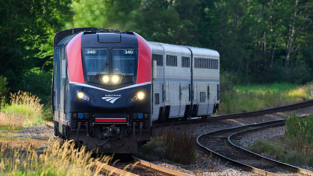 Everett, WA, USA - August 15, 2024; Amtrak Empire Builder approaches on curve with new ALC-42 locomotive