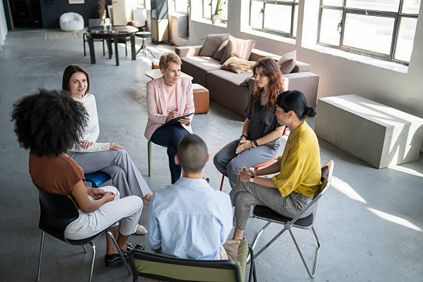 istock Diverse team of professionals collaborating in a modern office meeting 2254671737