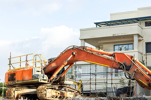 Closeup Excavator at demolition site, side view, background with copy space, full frame horizontal composition