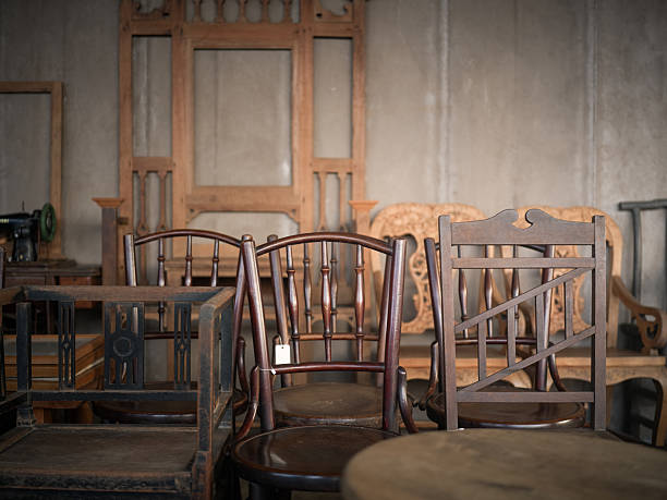 Various Wooden Chairs in an Old Storage Warehouse