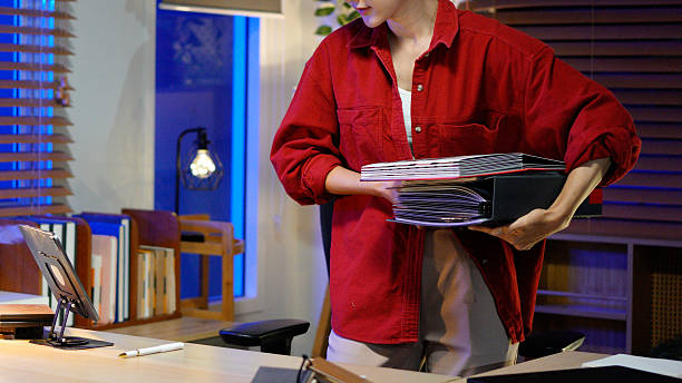 istock female Interior Designer working late at night in her dimly lit studio 2254690273