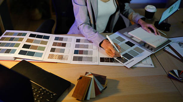 istock Woman architect designer select material compare samples finishing. Female interior creator choosing renovation materials with swatch spectrum. 2254690987