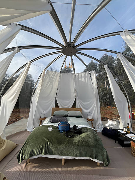 istock A transparent bubble hotel sits in the sun, offering a unique glamping accommodation experience 2254692715