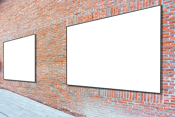 istock Blank advertising panels on a brick wall 2254699795