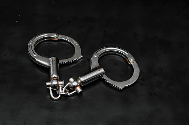 istock Professional metallic high security handcuffs 2254701527