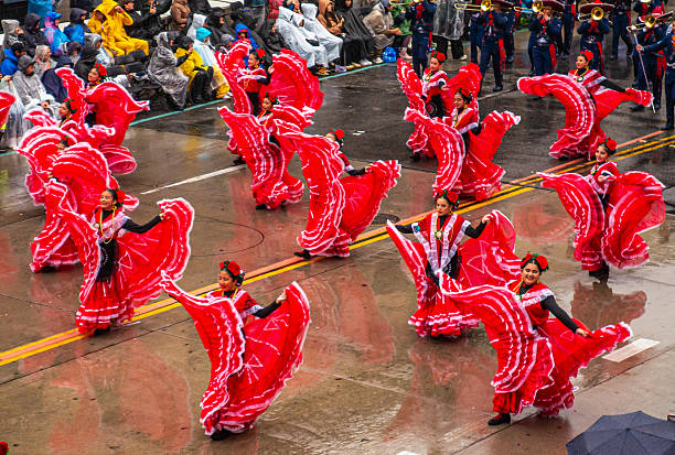 Pasadena, California, January 1, 2026. Dancers from the Delfines Marching Band, from Xalapa, Veracruz, Mexico, in the Rose Parade. Also known as the Tournament of Roses Parade, in which floats decorated with flowers, marching bands, and equestrian units parade down Colorado Boulevard in Pasadena, California, preceding the Rose Bowl football game.