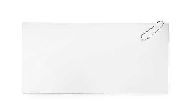 istock Blank paper sheet attached with clip isolated on white, top view 2254711236