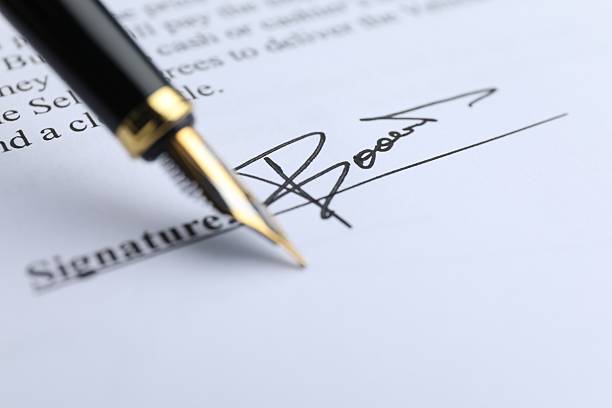 istock Fountain pen leaving signature on contract, closeup 2254711405