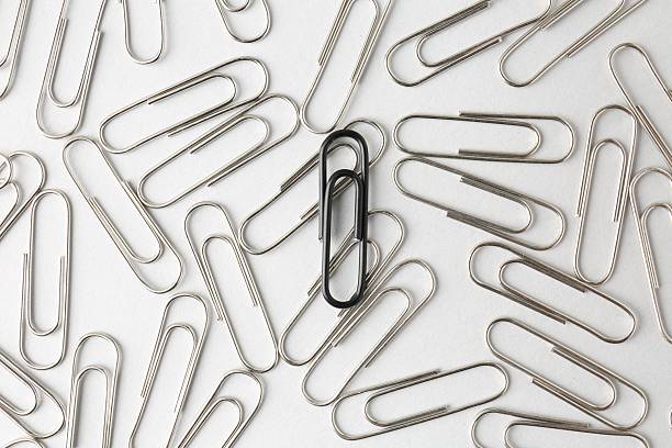 istock Many paper clips on light background, flat lay 2254712188