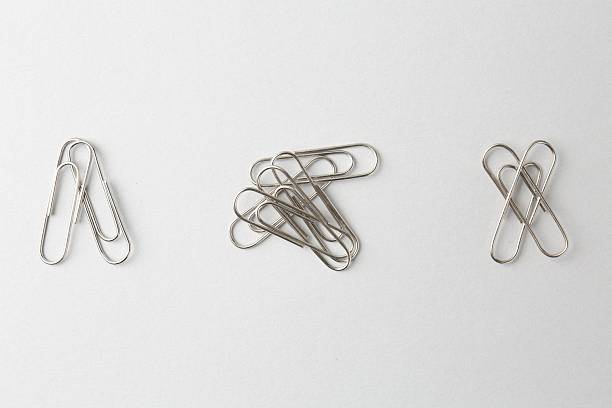 istock Metal paper clips on light background, flat lay 2254712204