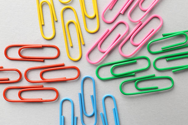 istock Colorful paper clips on light background, flat lay 2254712407
