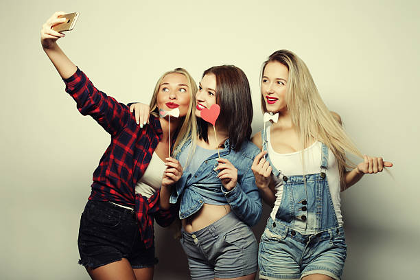 istock funny girls, ready for party, selfie 2254712477