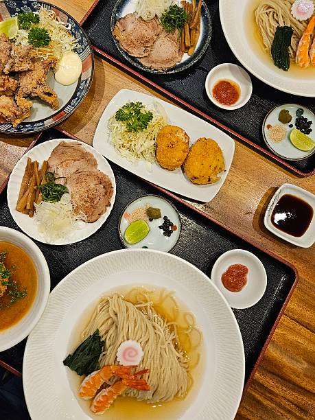 istock Japanese Ramen and Tsukemen with Fried Chicken and Side Dishes on Dining Table 2254713098