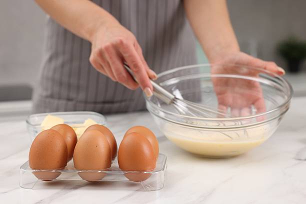 istock Woman making dough at white marble table indoors, selective focus 2254713330